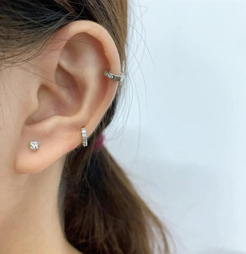 12 Pairs CZ Stud Earrings 16G Cartilage Earring Set For Tragus Helix And Ear Piercings, Hypoallergenic 316L Stainless Steel With Clear Cubic Zirconia, Tiny Ball Screw Back Earrings, Cute Heart And Flower Designs For Women. on ear with CZ studs and hoop cartilage ring