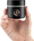 Solid Vacuum Sealed Coffee Canister With Date Dial Crafted From Heavy Duty 304 Stainless Steel Moisture Proof Jar held in hand with coffee beans inside.