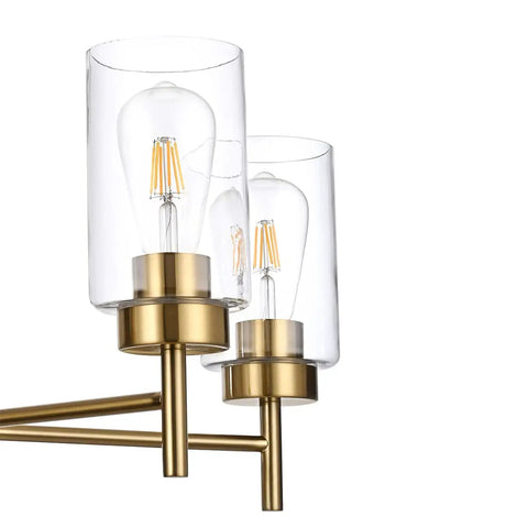 Close-up of clear glass shades with bulbs on a modern matte black pendant lighting for dining room and kitchen island chandelier.