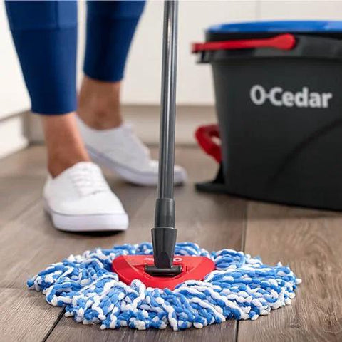 Person using RinseClean Spin Mop And Bucket System For Clean Water Mopping Lets You Clean With Clean Water From Start To Finish Removes 99 Percent Of Bacteria With Just Water Built In Foot Pedal For Hands Free Wringer And Easy Rinse on wooden floor