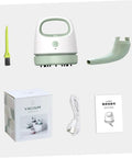 Fuss Free Rechargeable Desktop Vacuum Cleaner That Knocks Dust And Pet Hair To The Curb In Seconds with USB charging cable and brush.