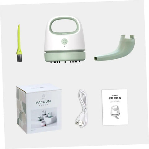 Fuss Free Rechargeable Desktop Vacuum Cleaner That Knocks Dust And Pet Hair To The Curb In Seconds with USB charging cable and brush.