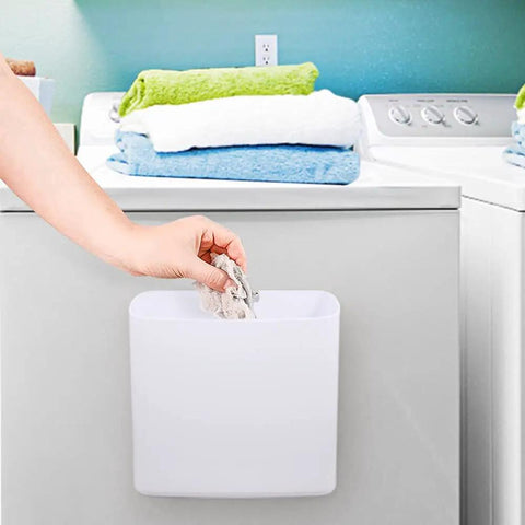 Person using Magnetic Laundry Storage Bins, 2 Pack Lint Holder Trash Bins for Dryer Or Washer, durable plastic hanging on dryer.