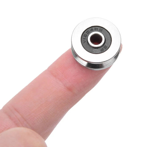 Rock Solid 10 Pack V1804 2RS V Groove Ball Bearings Miniature Roller Bearing 4X18X8mm on finger for scale.