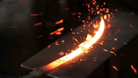 Oftner Hand Forged Scythe Blade From Austria, 34 Inch Length, heated during forging process with sparks, Austrian steel