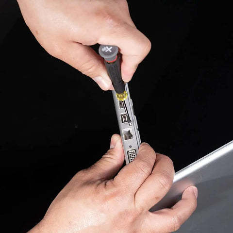 Person using Tiny 8 Piece Mini Precision Screwdriver Set For Electronics And Terminal Blocks With Cushion Grip Handles on a device