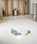 Sleek stainless steel door catch on white floor with screwdriver, perfect for yacht cabin doors to upgrade your boat.