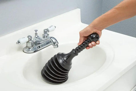 Heavy Duty Sink And Drain Plunger For Kitchen And Bathroom Sinks Showers And Bathtubs With A Beefy Four Cup Bellows For Double Power Compact Yet Mighty For Commercial And Residential Drains Black in use in white sink