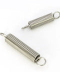 Grab These Top Tier Tension Springs Made From 304 Stainless Steel For Heavy Duty Extensions And Loads, Featuring Tiny Coils With 0.3MM Wire Diameter To Keep Gear Locked And Loaded Like A Boss, showing two stainless steel tension springs.