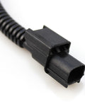 Close-up of a connector from the VCM Muzzler Harness Disable Kit For Honda 3.5L V6 Engine With VCM Fits Honda Acura Pilot Accord Odyssey Ridgeline 2 Pack Durable Connectors For Easy Plug And Play Install And Real World Performance Enhancement.