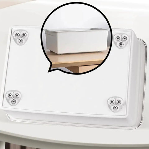 No Sweat Self Adhesive Mini Caster Wheels Pack Of Twelve mounted on a light storage bin showing smooth glide surface.