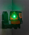 Compact Self Leveling Laser Level With Plumb Spot, Bright Green Cross Lines, 75 Foot Range on magnetic mount, wall installation