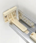 Close-up of heavy duty plastic Undermount Drawer Slide Rear Mounting Brackets Plastic Replacement Rear Sockets in a cabinet.