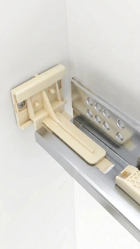 Close-up of heavy duty plastic Undermount Drawer Slide Rear Mounting Brackets Plastic Replacement Rear Sockets in a cabinet.