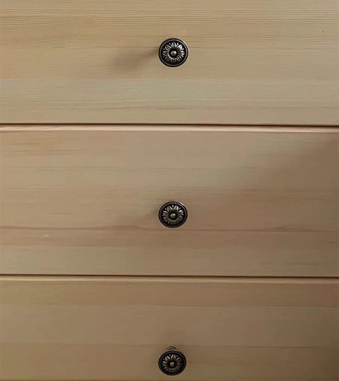 Antique Bronze Flower Knob Set for Cabinets and Drawers installed on wooden dresser, showing vintage flower-shaped cabinet hardware pulls.