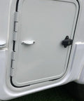 Premium 2 Pack White RV Door Stop Retainer Tool for Motorhomes and Travel Trailers holding a secure white door in place.