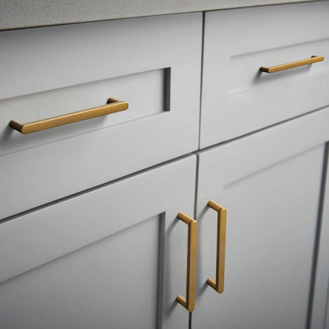 Antique Brass Cabinet Pulls Set Of 6, 5 Inch Center To Center, Minimalist Vintage Drawer Handles installed on modern white cabinetry