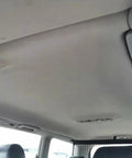 Installed light grey headliner fabric with foam backing in vehicle interior