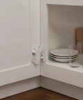 Push To Open Cabinet Touch Latch Spring Rebounder For No Touch Handleless Kitchen And Wardrobe Doors White PP Plastic Compact Size For Hidden Install Discreet Inside Furniture Frame Mount in use inside a cabinet