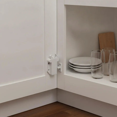 Push To Open Cabinet Touch Latch Spring Rebounder For No Touch Handleless Kitchen And Wardrobe Doors White PP Plastic Compact Size For Hidden Install Discreet Inside Furniture Frame Mount in use inside a cabinet