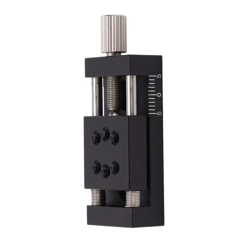 Knockout Heavy Duty Manual Linear Actuator Stage Featuring Smooth Glide Aluminum Dovetail Slide Platform and Dead Set Micro Tuning Adjustments For Real World Job Sites, close-up view with adjustment knob.