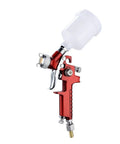 Mini Air Paint Sprayer With Slick 0.8 And 1.0mm Tips For Straight Smooth Finishes On Cars And Walls Featuring Legit Mist Quality, showcasing red body and clear reservoir.
