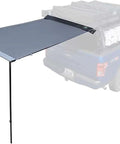 Nomadic 4.5 Foot RV Awning With 30 Square Feet Coverage, 280G Poly Cotton Ripstop Grey Body Green Trim on blue vehicle