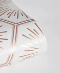 Roll of Metallic Autumn Bronze Hello Sunshine Peel And Stick Wallpaper with honeycomb geometric design, 20.5 in x 16.5 ft size.