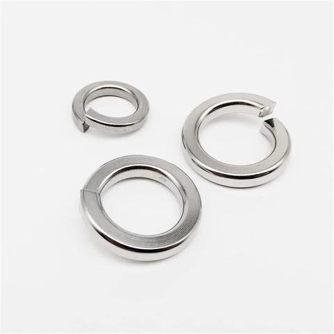 Beefed Up Stainless Steel Spring Lock Washer Kit With 1035 Pcs Assortment For M1.6 To M16 Sizes, 304 A2 70 Alloy, Prevents Loosening In Machinery Automotive Bikes And DIY Projects. close-up of stainless steel spring lock washers