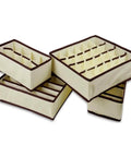 Four Piece Plastic Drawer Organizers With Six Seven Eight Compartments In Warm Beige for closet sorting and office cleanup.
