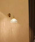 Wall Sconce Lights Indoor Bedroom Hallway Vintage Glass with Pull Chain,Industrial Adjustable Fixture,Brass Lamp for Living Room,E27 Base mounted on wall with clear glass shade.