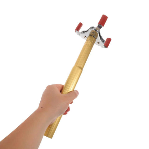 Ladder Free Smoke Detector Remover Tool Aluminum Alloy Transducer Gripper held in hand for easy sensor swaps.