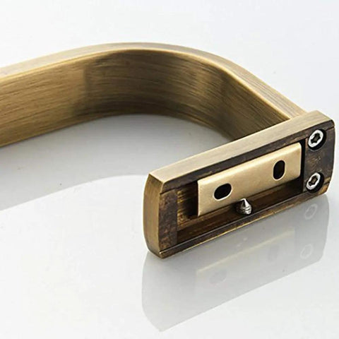 Close-up of Brass Bathroom Accessories Set With Towel Bar end, vintage antique brushed brass finish, wall mounted design.