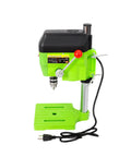 Built Different 480W Mini Bench Drill Press For Wood Metal PCB Tasks With Dual Speed Modes Compact Table Machine with green body and drill.