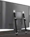 Heavy Duty Metal Anti Tip Straps Keep Your Furniture Locked Down Tight With Adjustable Wall Anchors on a TV's back, secured with clamps.