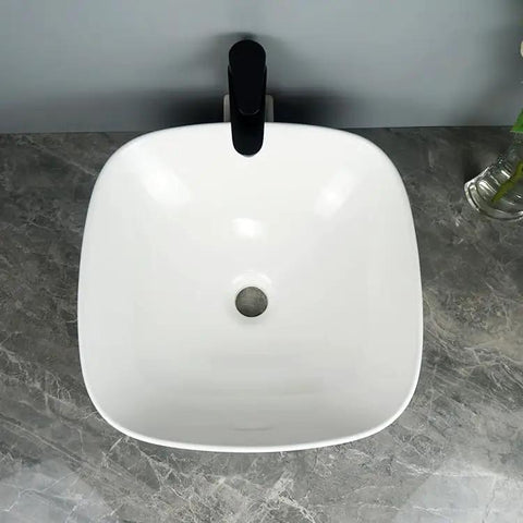 Top view of USZWBY Vessel Sinks Bathroom Vessel Sink Household Small Space Ceramic Wash Basin with smooth edges.