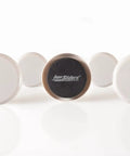 Round Two And Half Inch Reusable Furniture Sliders For Carpet Eight Pack Beige shown on white background.