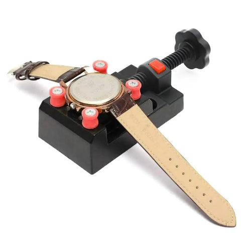 Compact Bench Vise Clamp With Handy Ergonomic Handle And Precision Mechanism, Flat Opening For Watch Repair, Jewelry Making, Sculpture And DIY Projects, Locking System, Small Vise Tool For Crafts And Electronics holding a wristwatch