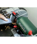 Heavy Duty 8 Inch Bench Grinder With 3600 Rpm And 5.5 Amp Motor delivering sparks while sharpening metal with protective eye shield.