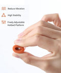Hand holding Silicone Heatbed Leveling Column For 3D Printers With Shock Absorption Mounts, demonstrating flexibility and design features