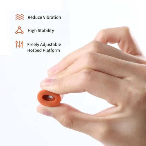 Hand holding Silicone Heatbed Leveling Column For 3D Printers With Shock Absorption Mounts, demonstrating flexibility and design features