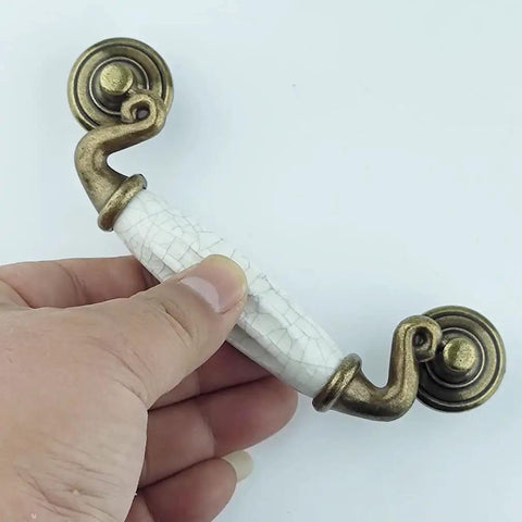 Drop Bail Dresser Drawer Pulls White Crackle Ceramic Knobs With Antique Bronze Finish, 5.5 Inch Length, held in hand view