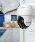 Outdoor WiFi PTZ Security Cam 1080P Waterproof With AI Human Detection And Color Night Vision mounted by poolside for monitoring.