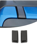 Slick Carbon Fiber Top Screws Protector Cover Trim Cap For 2021 Plus Vehicles, two carbon look screw caps on blue vehicle roof.