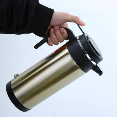 Person holding the Road Ready Dope Portable Water Heater For Car And Truck 12V 24V, showing stainless steel design.