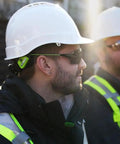 Man wearing Hard Hat Safety Glasses With Interchangeable Lenses Anti Fog Anti Scratch Ansi Certified Ppe Eyewear on a job site.