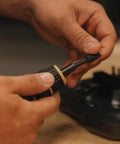 Person holding a Manual Firearms Torque Wrench With Inch-Pounds Readout, Bits, And Rugged Storage Case For Scope Mounts, Gunsmithing.