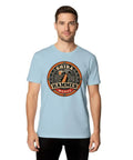 Cool Vintage Hammer Gear Badge Shiba T-Shirt For True DIY Guys Who Love Garage Art Retro Distressed Look Unisex Style With Bold Design on a man in a light blue shirt.