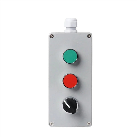 Metal push-button control box with green and red buttons and a bottom rotary switch.