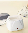 Dead Simple Compact Automatic Yogurt Maker With Food Grade Stainless Inner Pot And 360 Even Radiant Warmth For Smooth Homemade Dairy Culturing Right In Your Kitchen, pouring milk into yogurt maker.